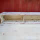 Large wooden desk with patinated bleacher