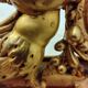 Antique mirror with a gilded frame and cherubs.
