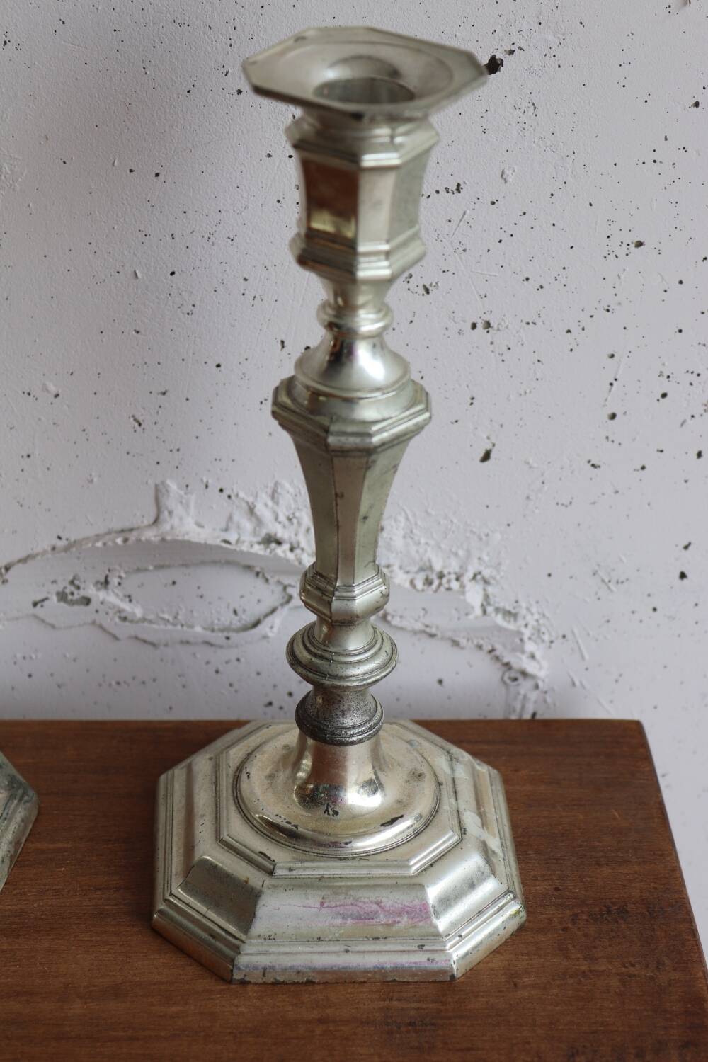 Pair of antique silver-plated metal candlesticks