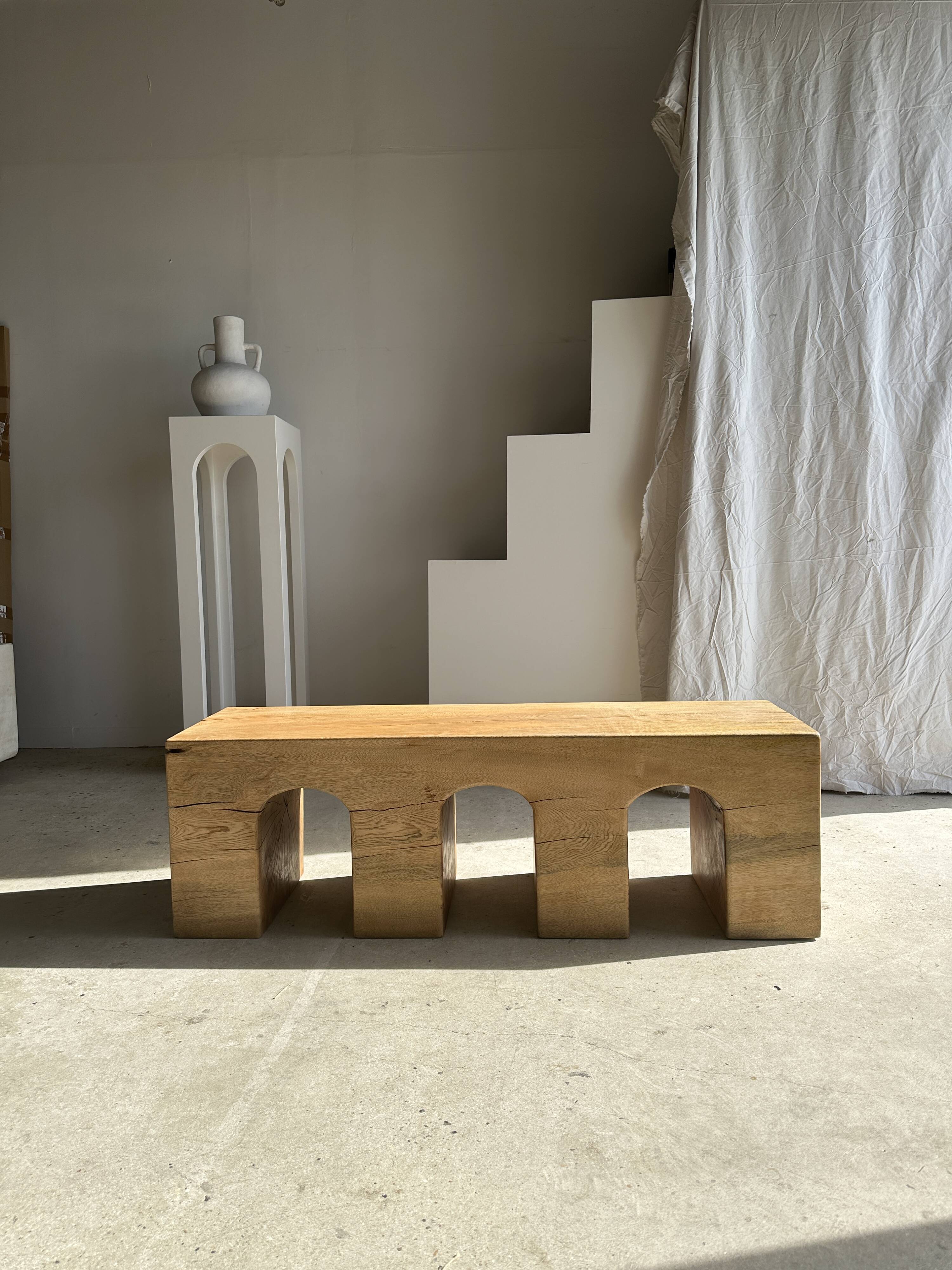 Solid monoxyl wood bench with carved 3-arch base - Natural wood color