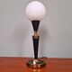 Black lacquered metal table lamp with satin white glass, 1950s.