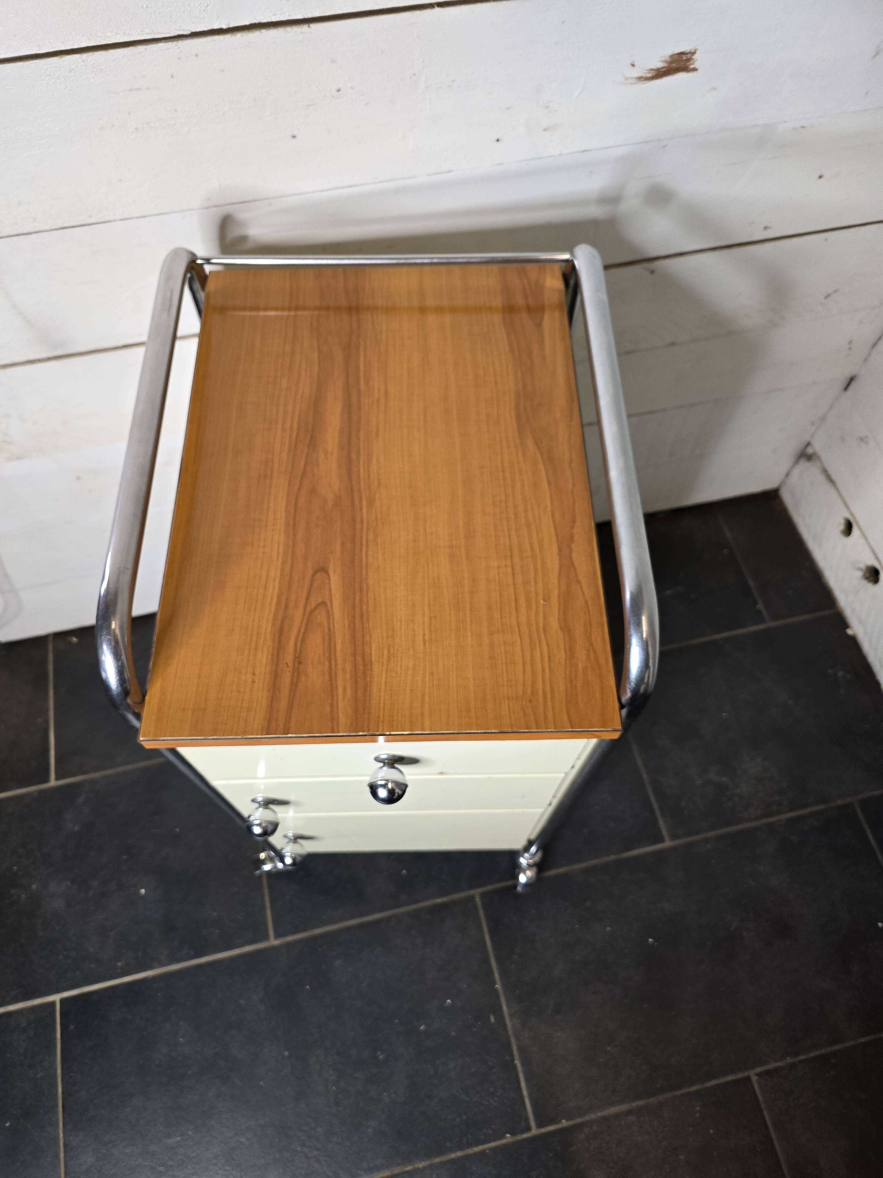 Mid-20th century metal cabinet table on wheels