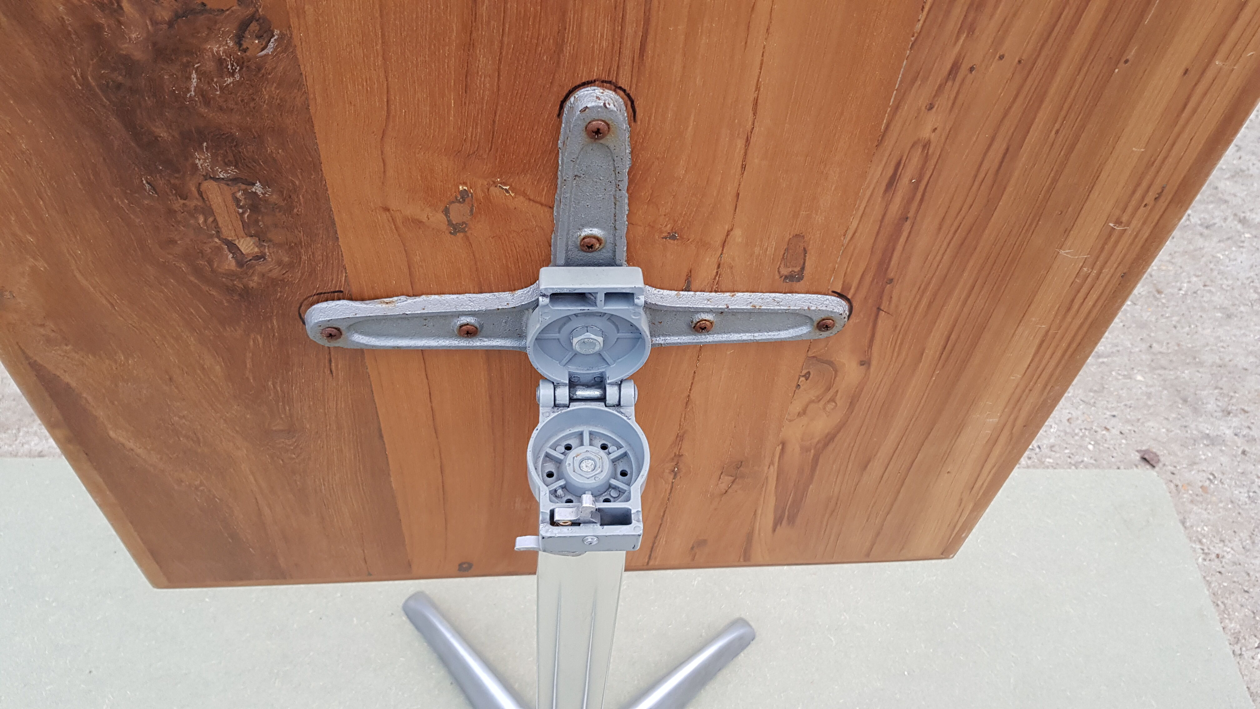 Foldable bistro table with teak top and aluminum base