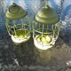 Duo of small metal lanterns