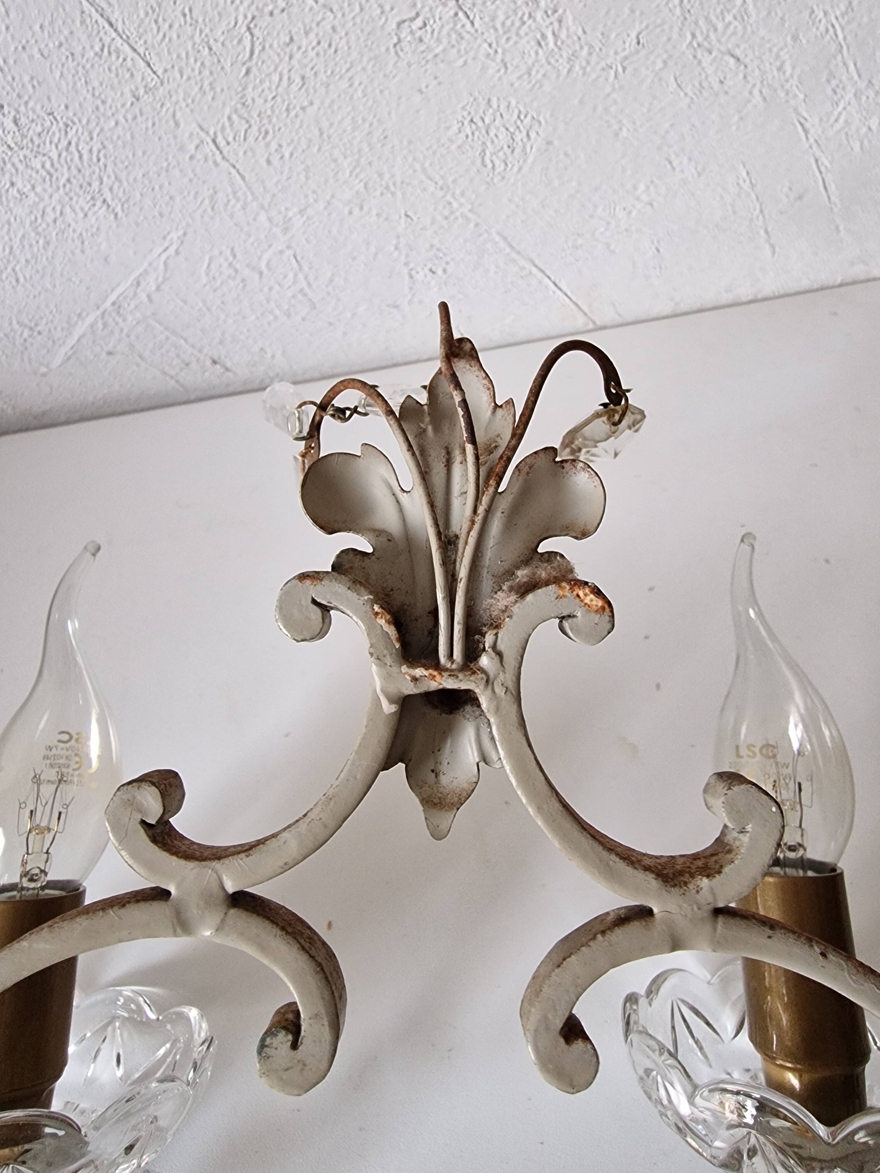 Pair of sconces in patinated metal and crystal tassels