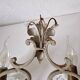 Pair of sconces in patinated metal and crystal tassels
