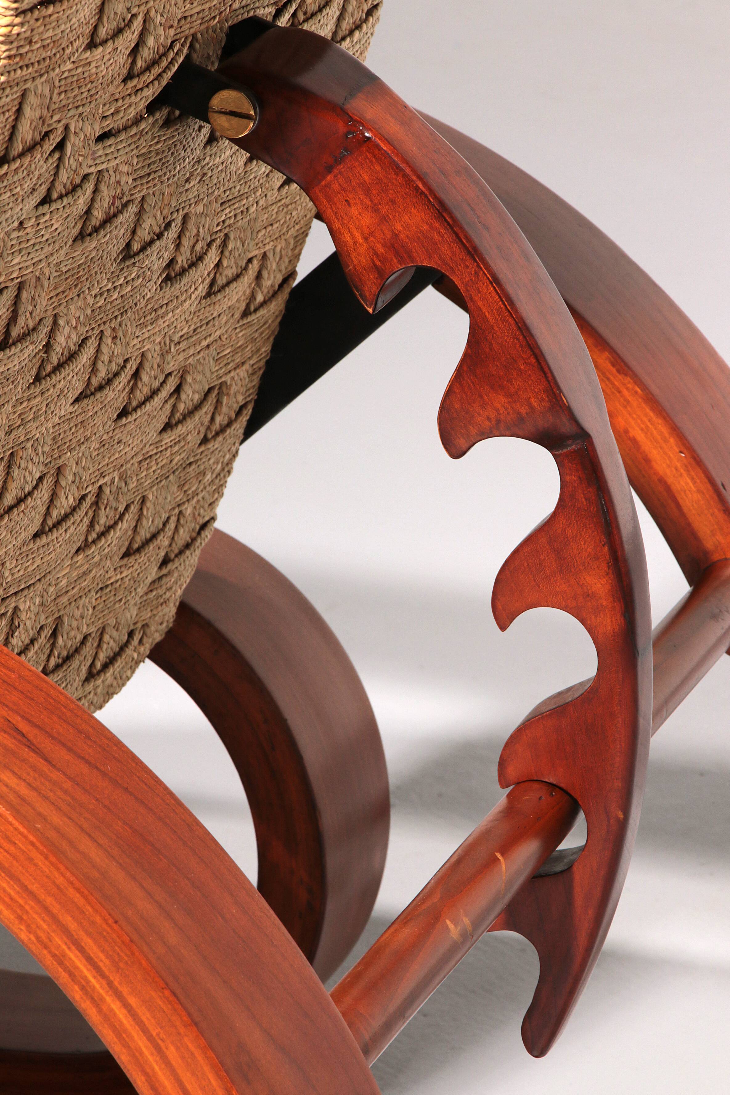 An exceptionally rare mahogany recliner crafted in Italy during the 1950s"