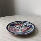 4 colorful flat plates with a fish pattern