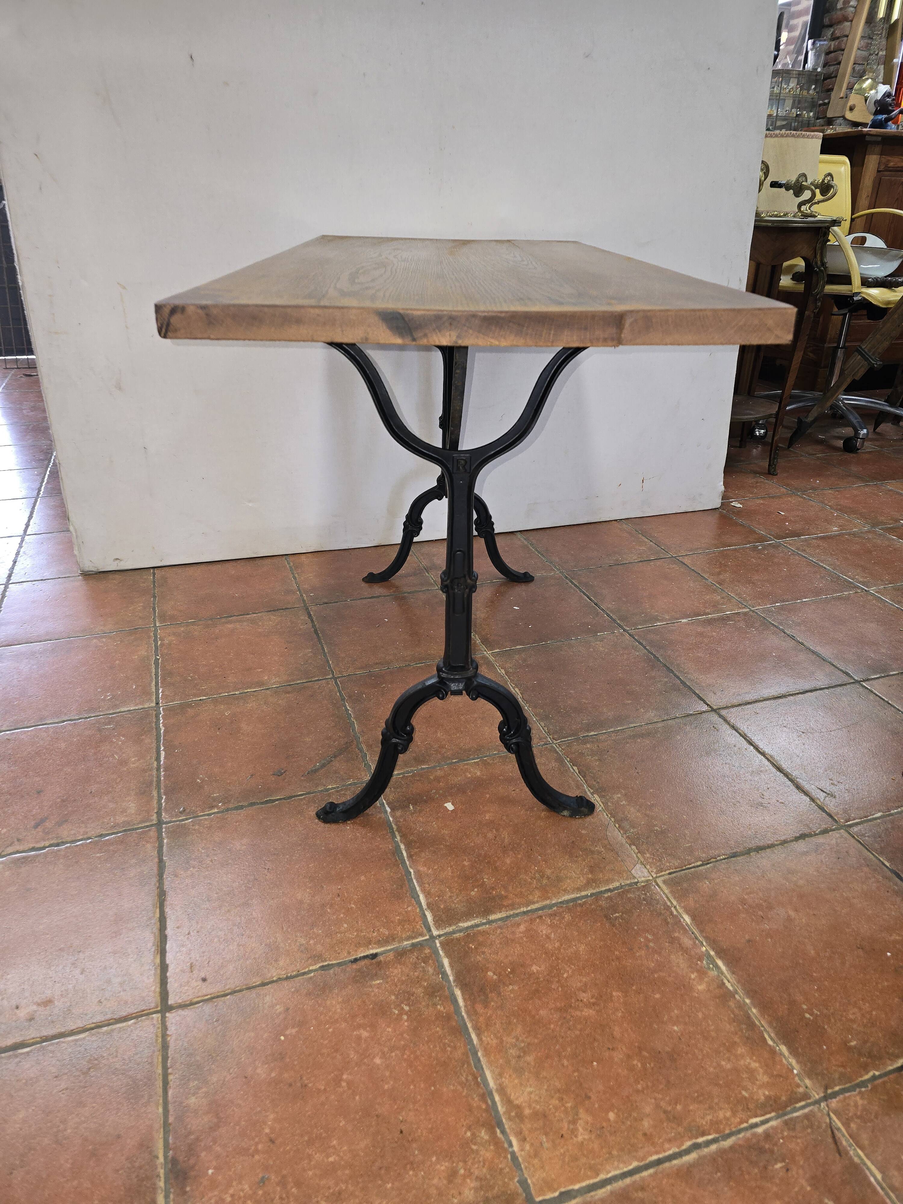 Old bistro table with oak top, cast iron base, 118 cm L
