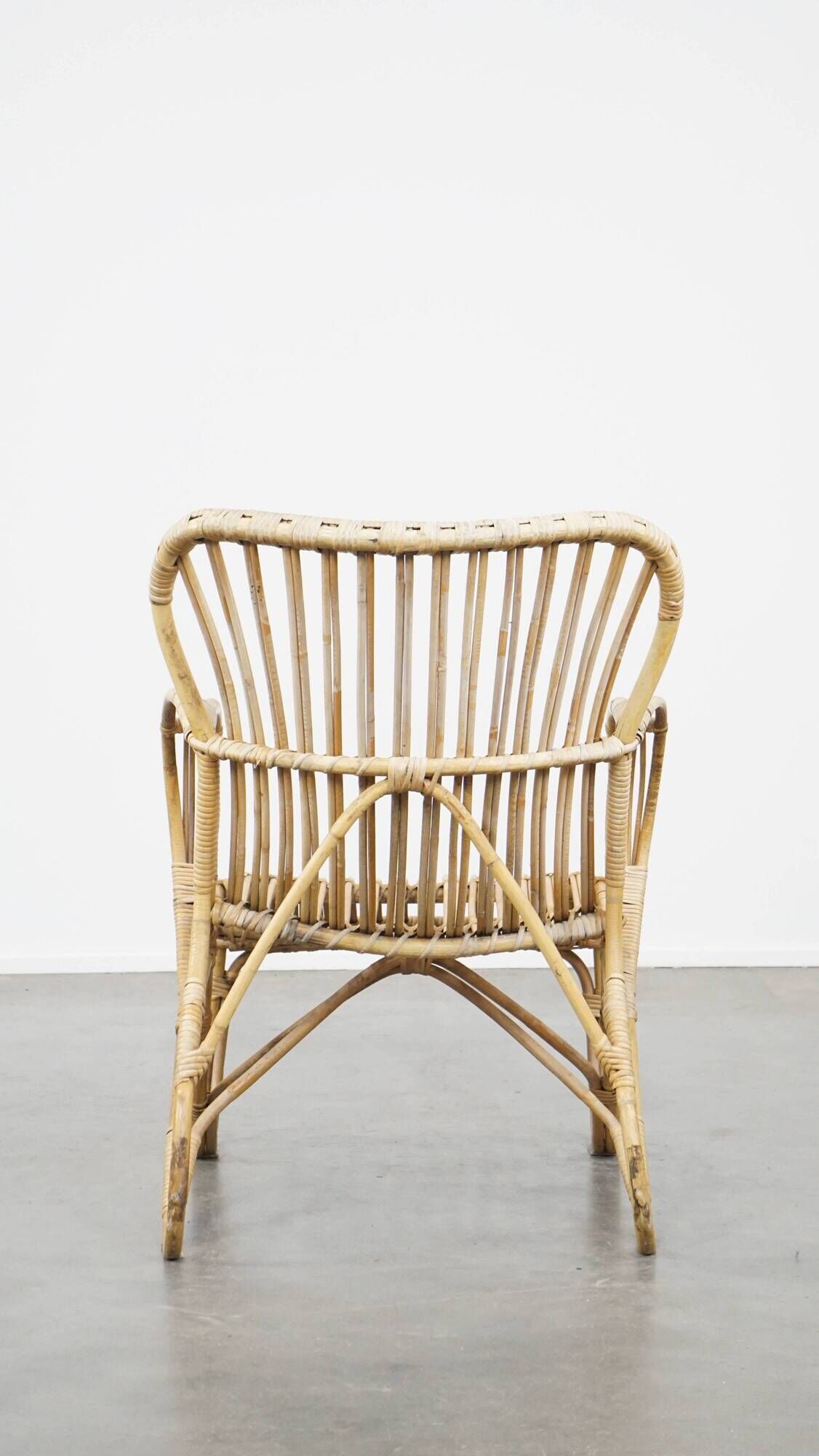 Vintage 1950s Dutch design rattan armchair with organic shapes