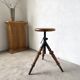 Tripod workshop stool in turned wood and cast iron — circa 1900
