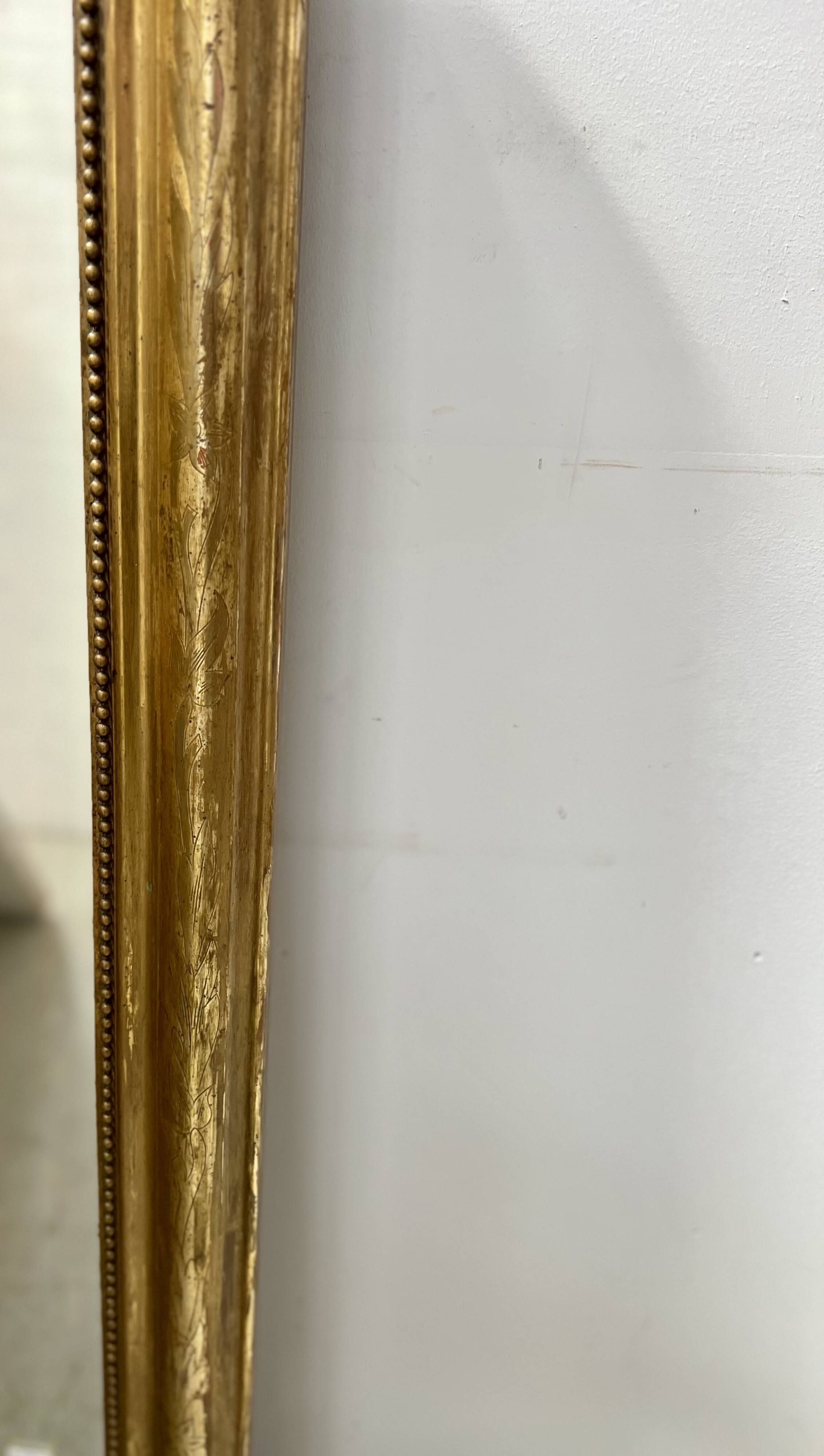 Louis Philippe mirror in wood and gilded stucco, 19th century