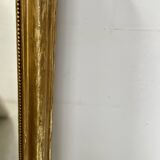 Louis Philippe mirror in wood and gilded stucco, 19th century