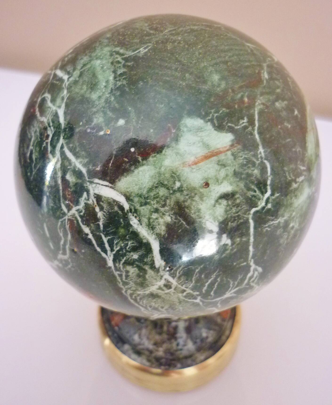 Stair railing ball in enameled cast iron imitating veined green, sea green marble.