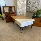 Coffee table with pin legs and gold leaf