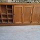 Oak workshop furniture with sliding doors.