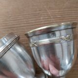 Antique egg cups on silver-plated metal stand