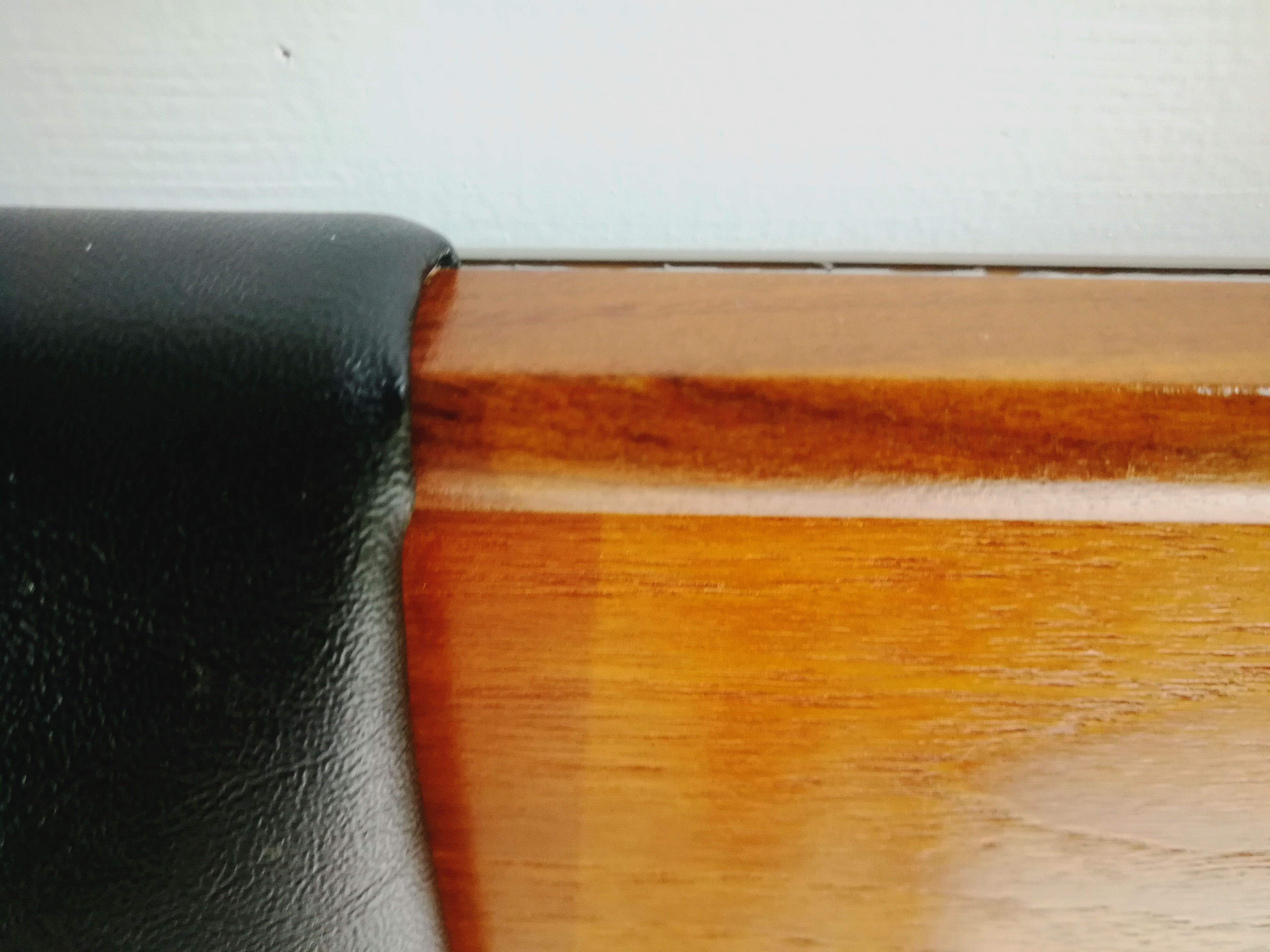 Mid century 1970s retro teak headboard with two hinged bedsides, upholstered in black by 'slumberlan
