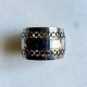 Openwork napkin ring in silver metal