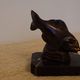 Art Deco pair of bookends with stylised fish in patinated metal and marble.