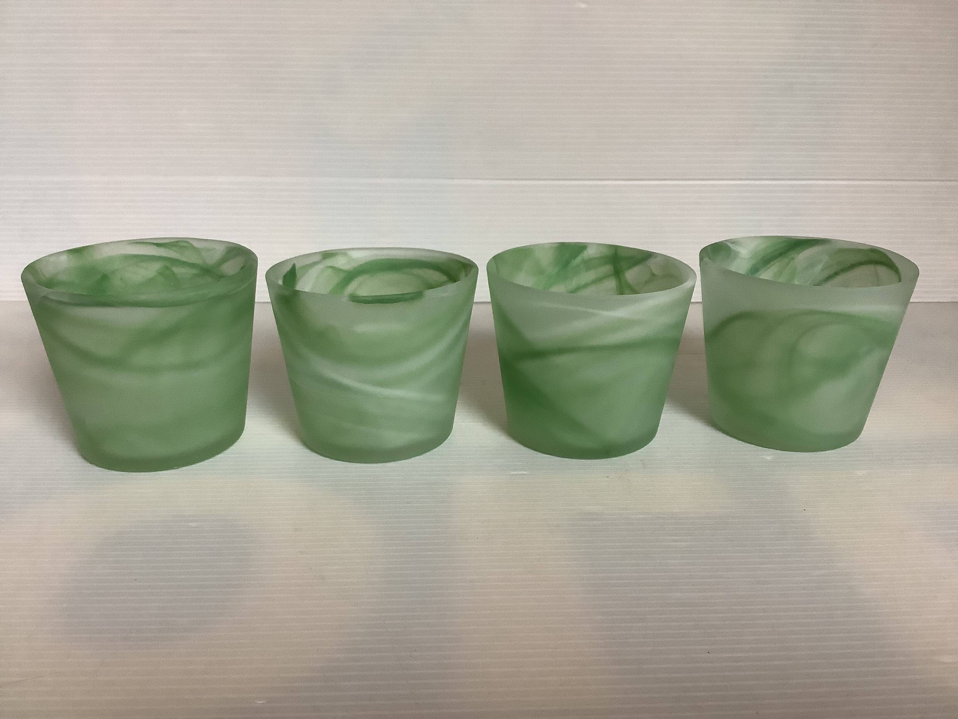 Four green glass paste candle holders