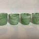 Four green glass paste candle holders