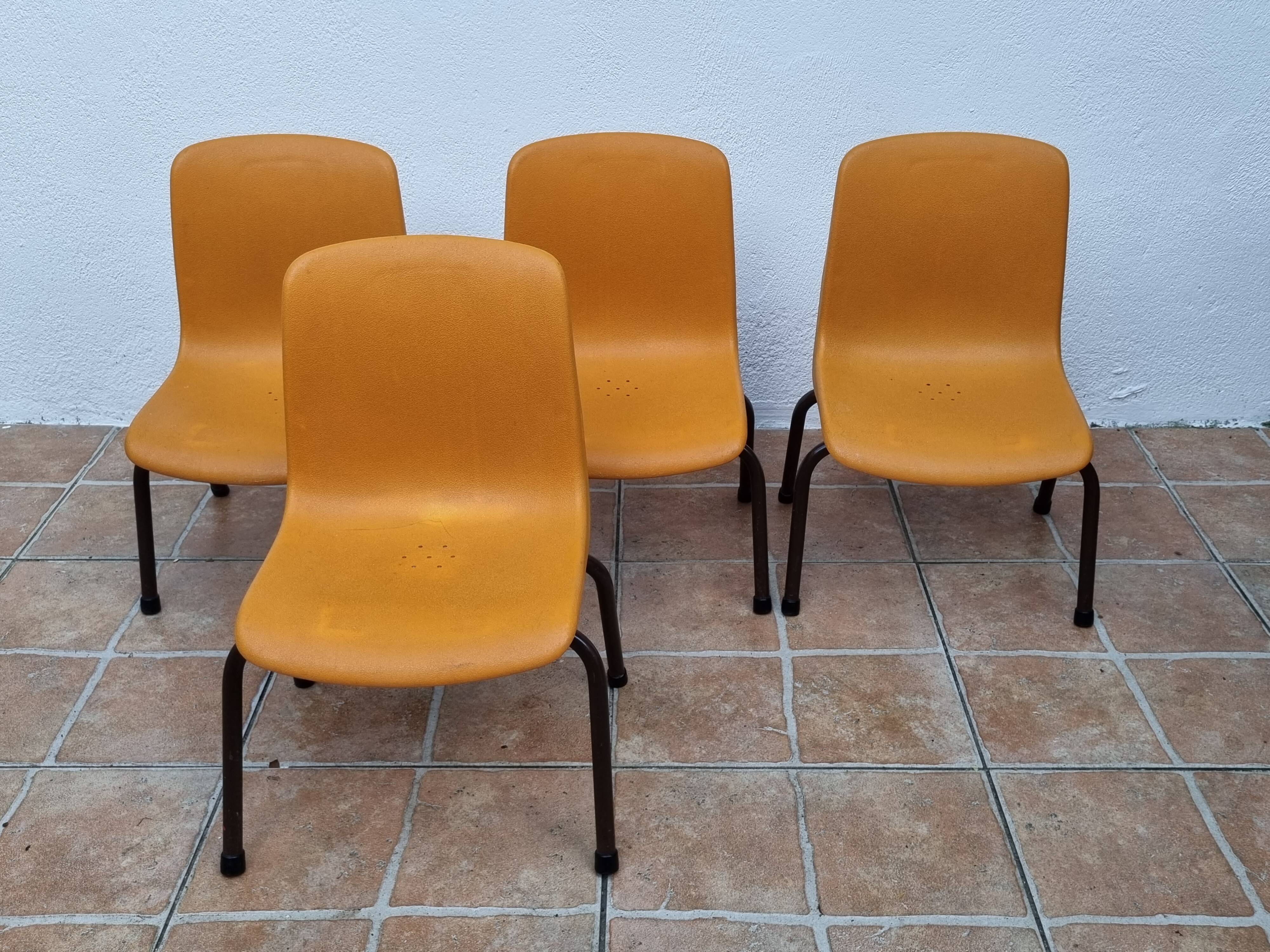 Set of 4 vintage Grosfillex school chairs, 60s-70s, orange plastic and tubular base