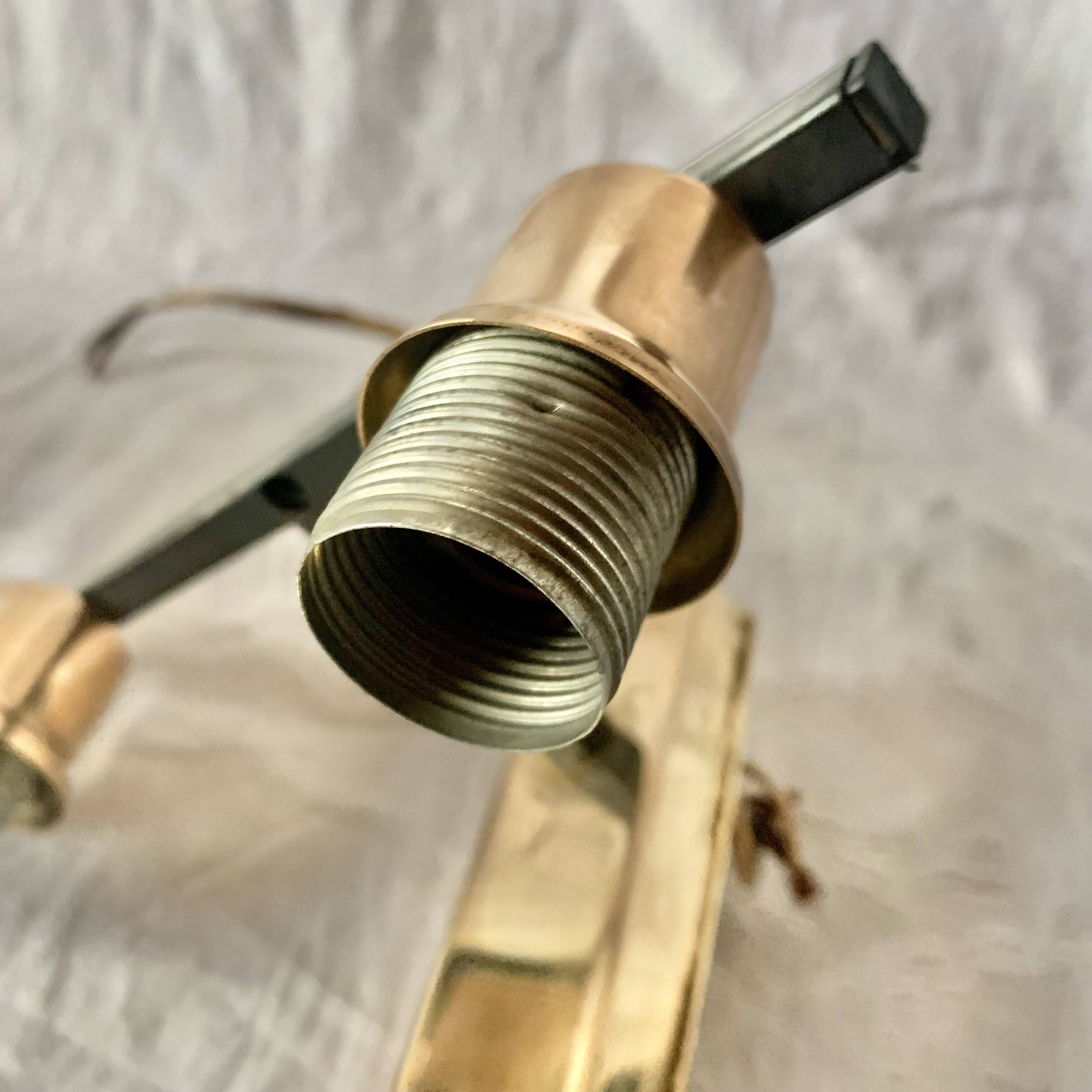 Pair of wall sconces in gilded brass and textured glass