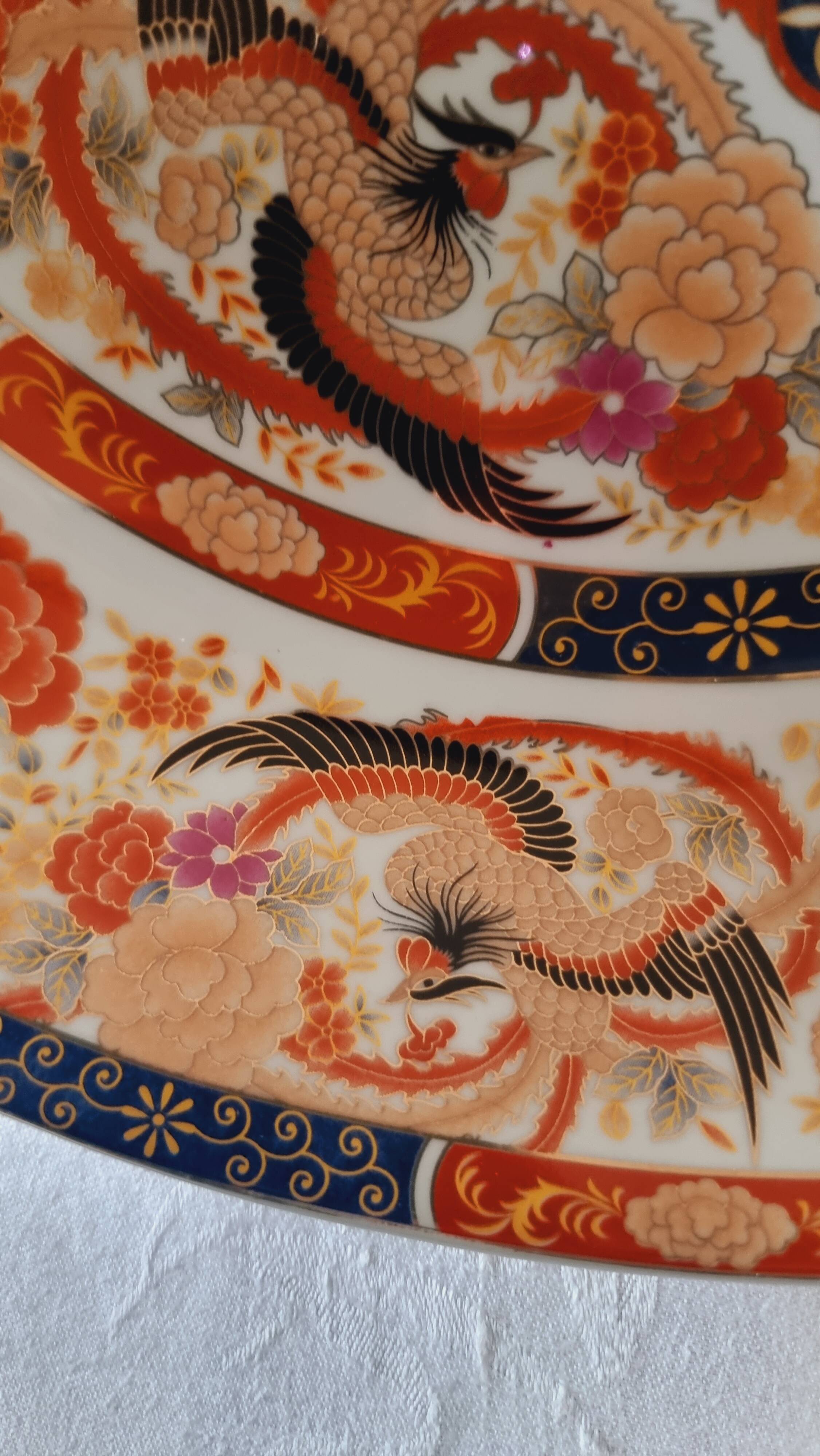 Large deep porcelain plate in Imari style (35.5 cm) with "Phe" decoration.