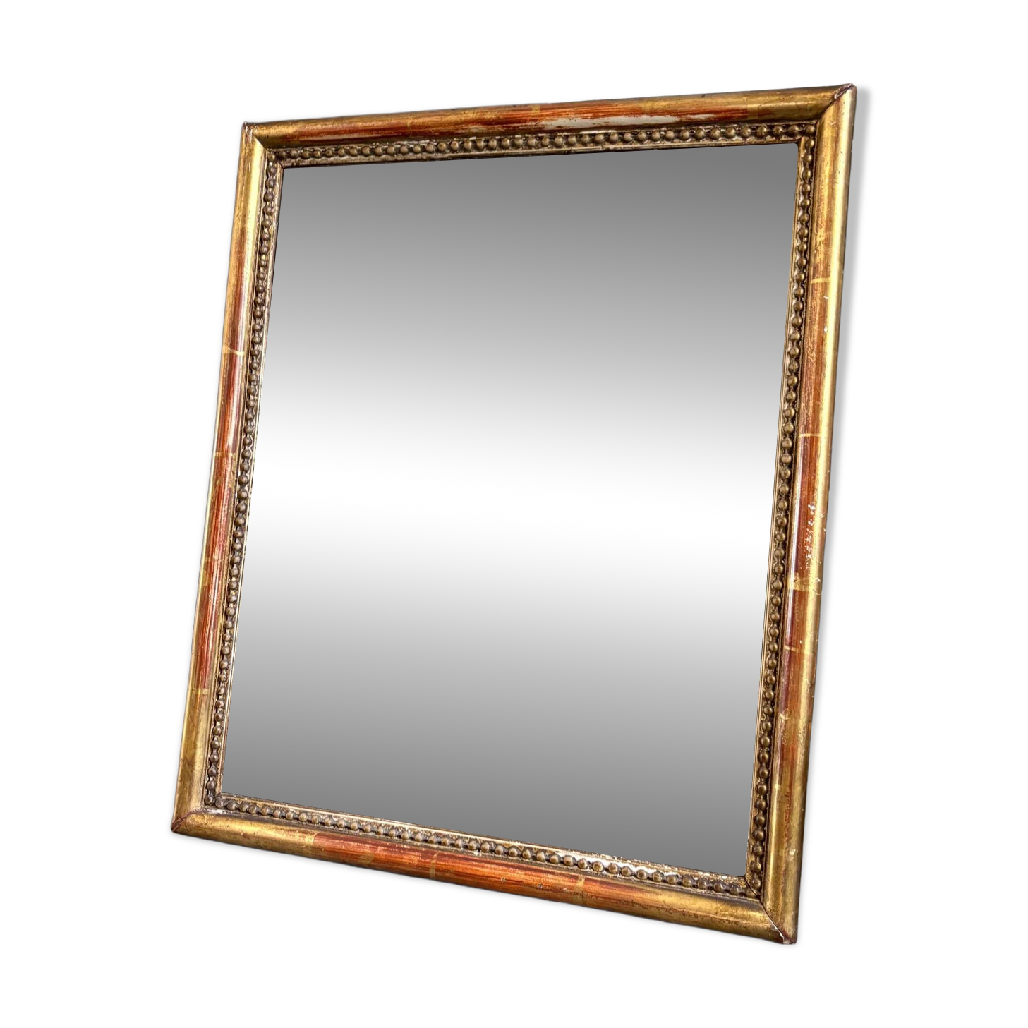 Wooden mirror with gilded stucco and beaded frieze, 45 x 37 cm