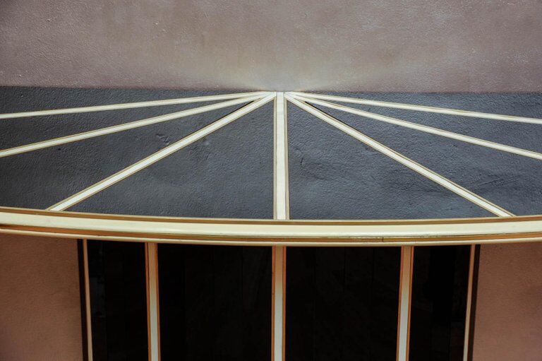 Console in black and cream tinted glass