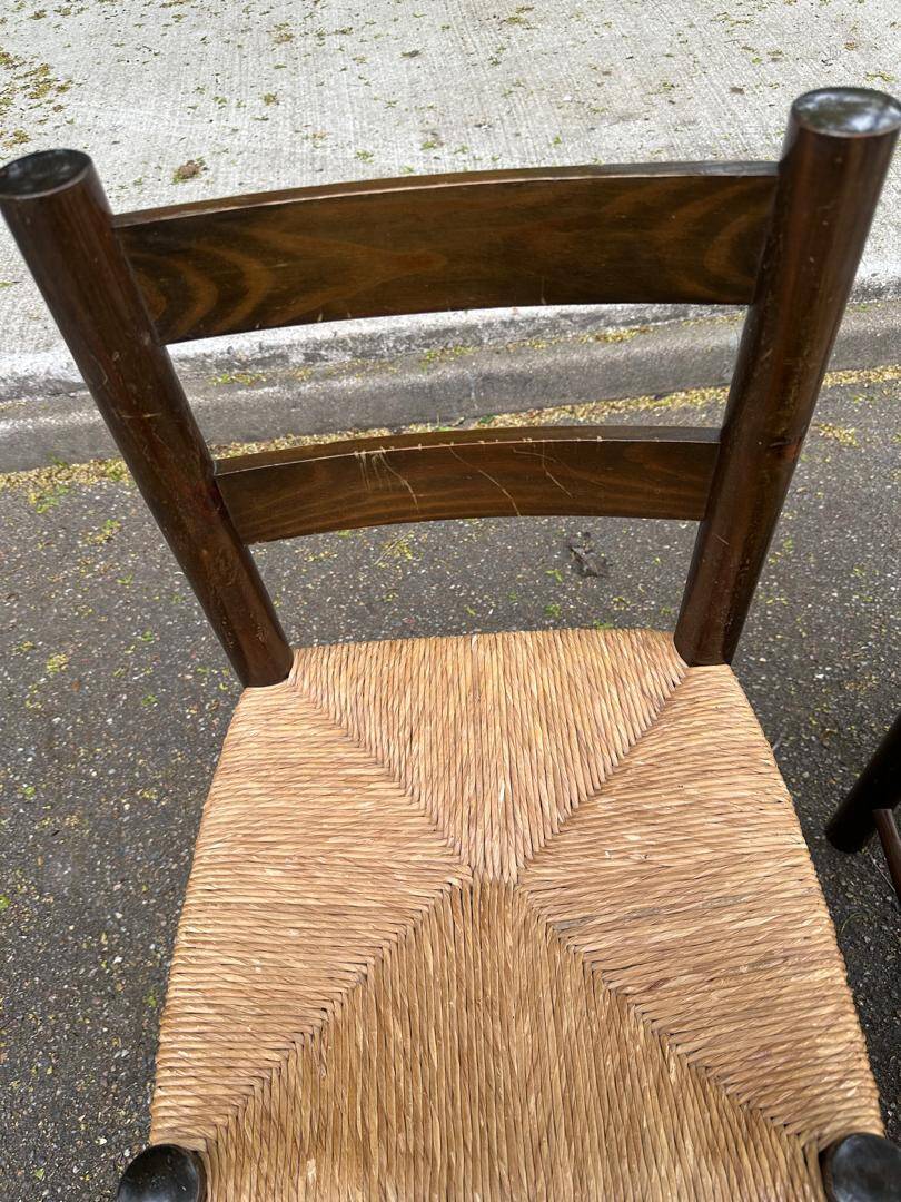4 solid oak chairs in dark colour with elephant upholstery.