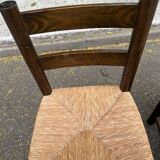 4 solid oak chairs in dark colour with elephant upholstery.
