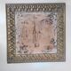 Antique tapestries framed in repoussé brass.