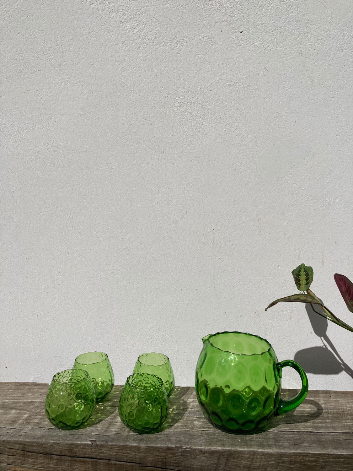 4 green water glasses and vintage blown glass carafe