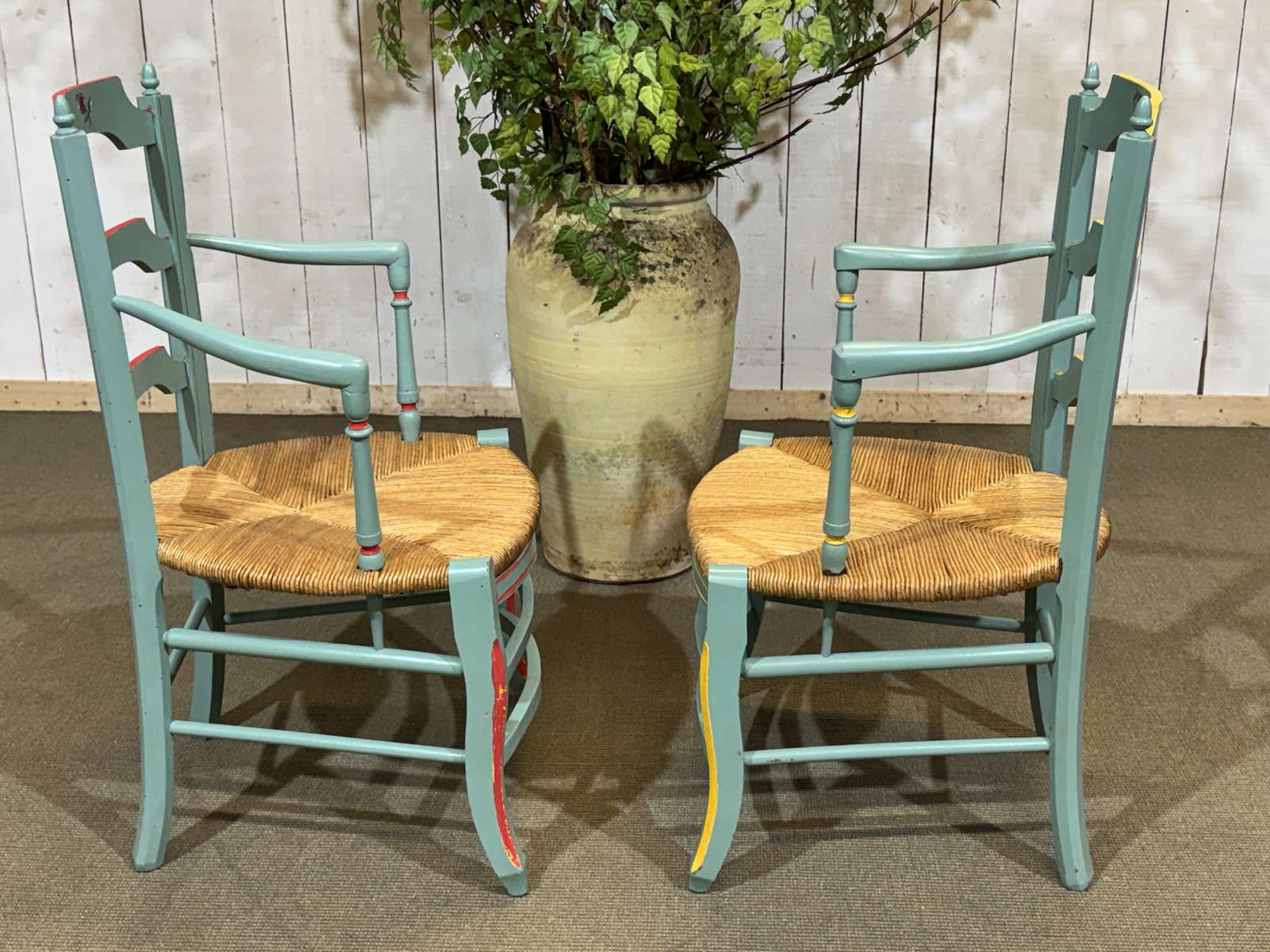 Pair of rustic armchairs in beech with straw seats.