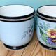Lot de deux cache-pots en porcelaine de Limoges