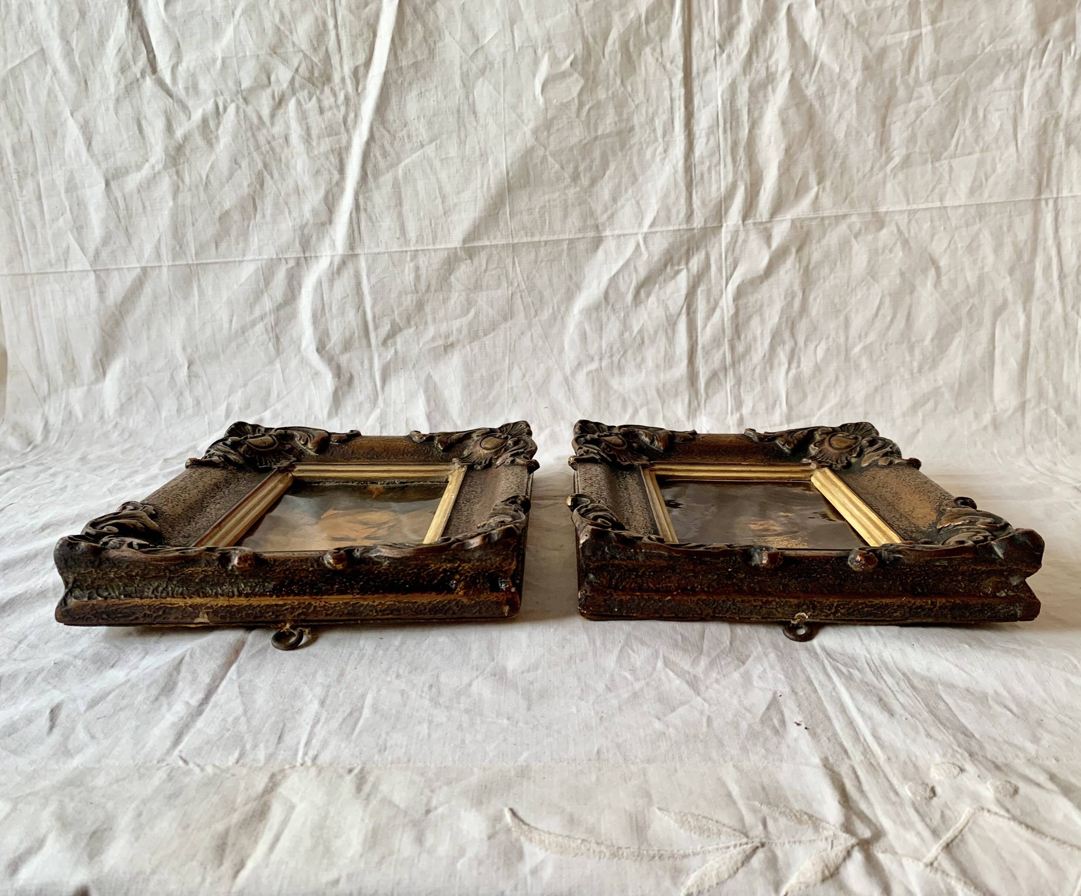 Pair of old carved wooden and plaster frames