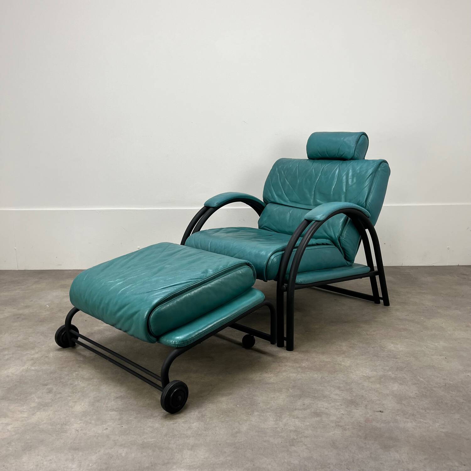Postmodern design armchair and ottoman, 80s leather