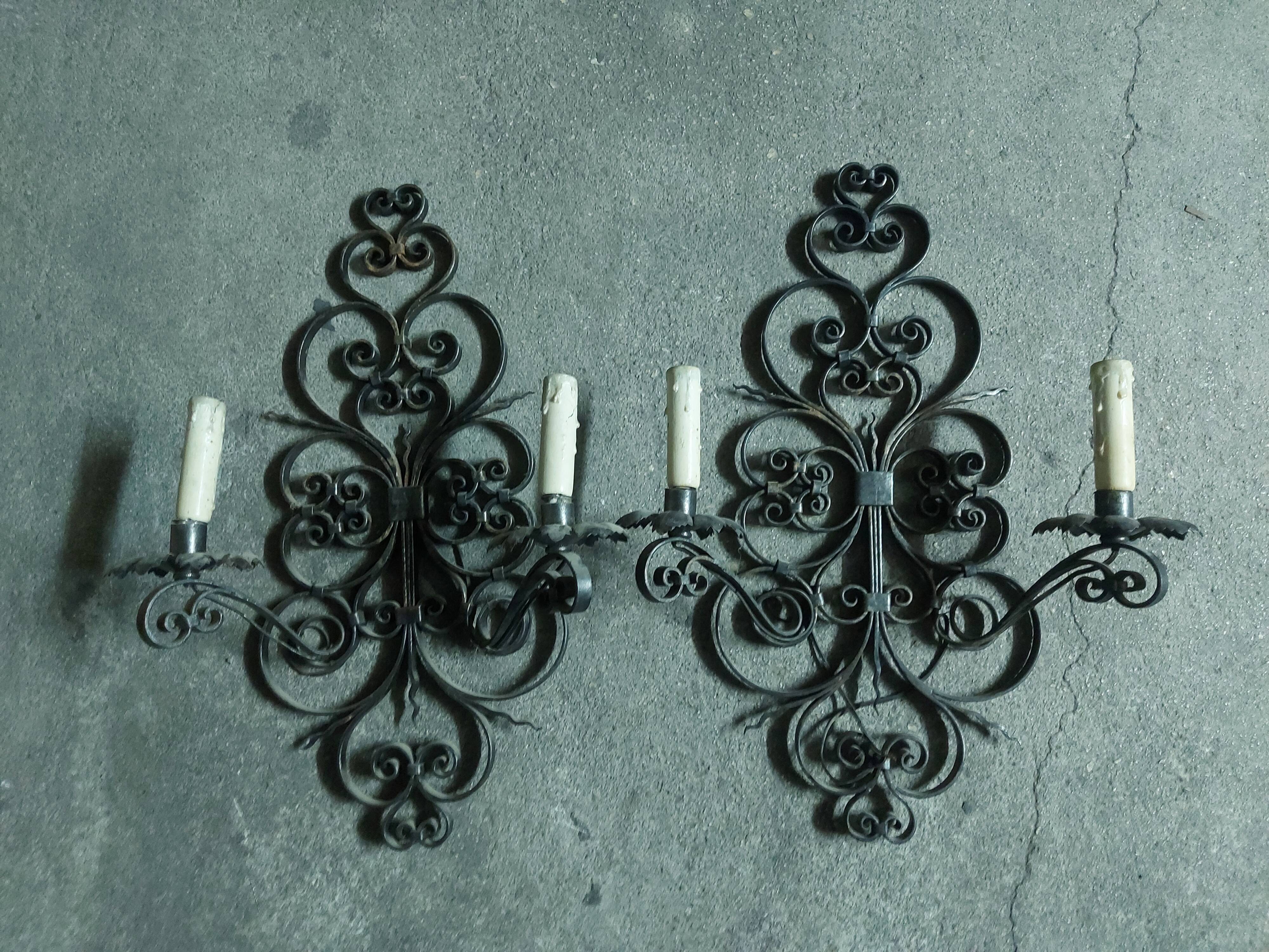 Two large wrought iron wall lights