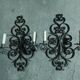 Two large wrought iron wall lights