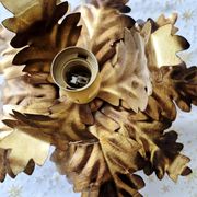 Vintage floral metal applique in gold.