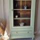 Glass display cabinet with drawer