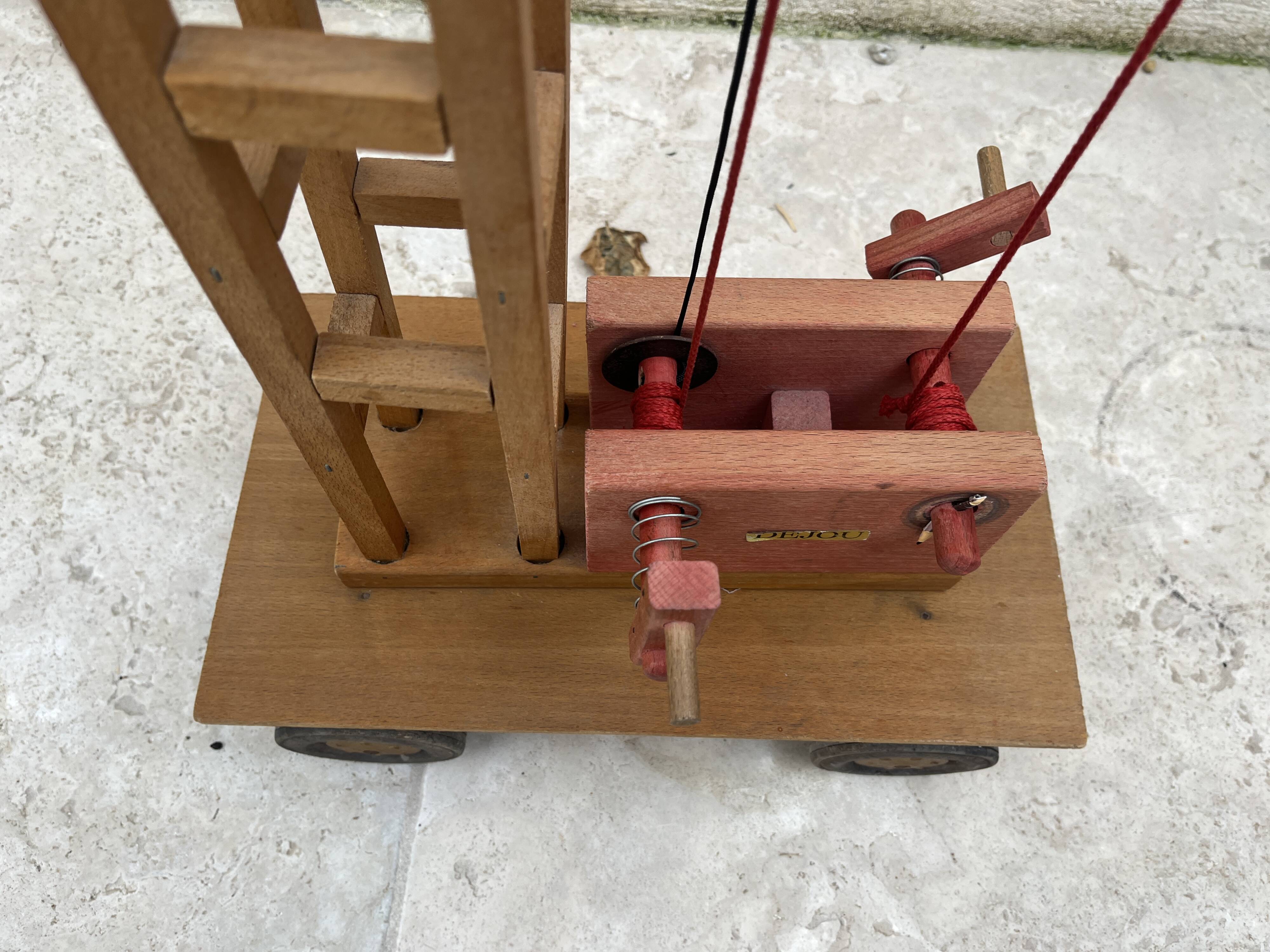 Vintage wooden crane toy from the 60s