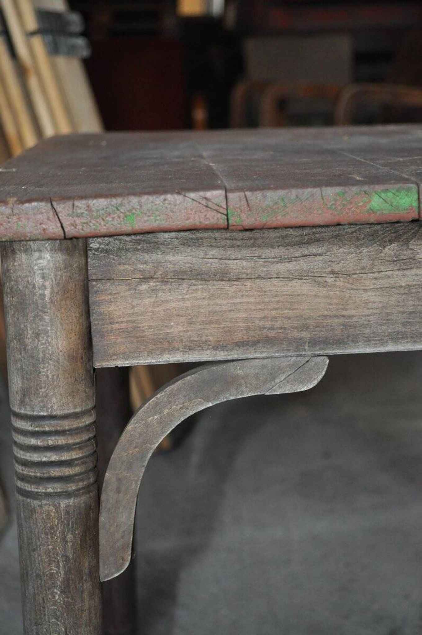 Rustic Thonet table in brown beech, circa 1920, with slatted top and turned legs.