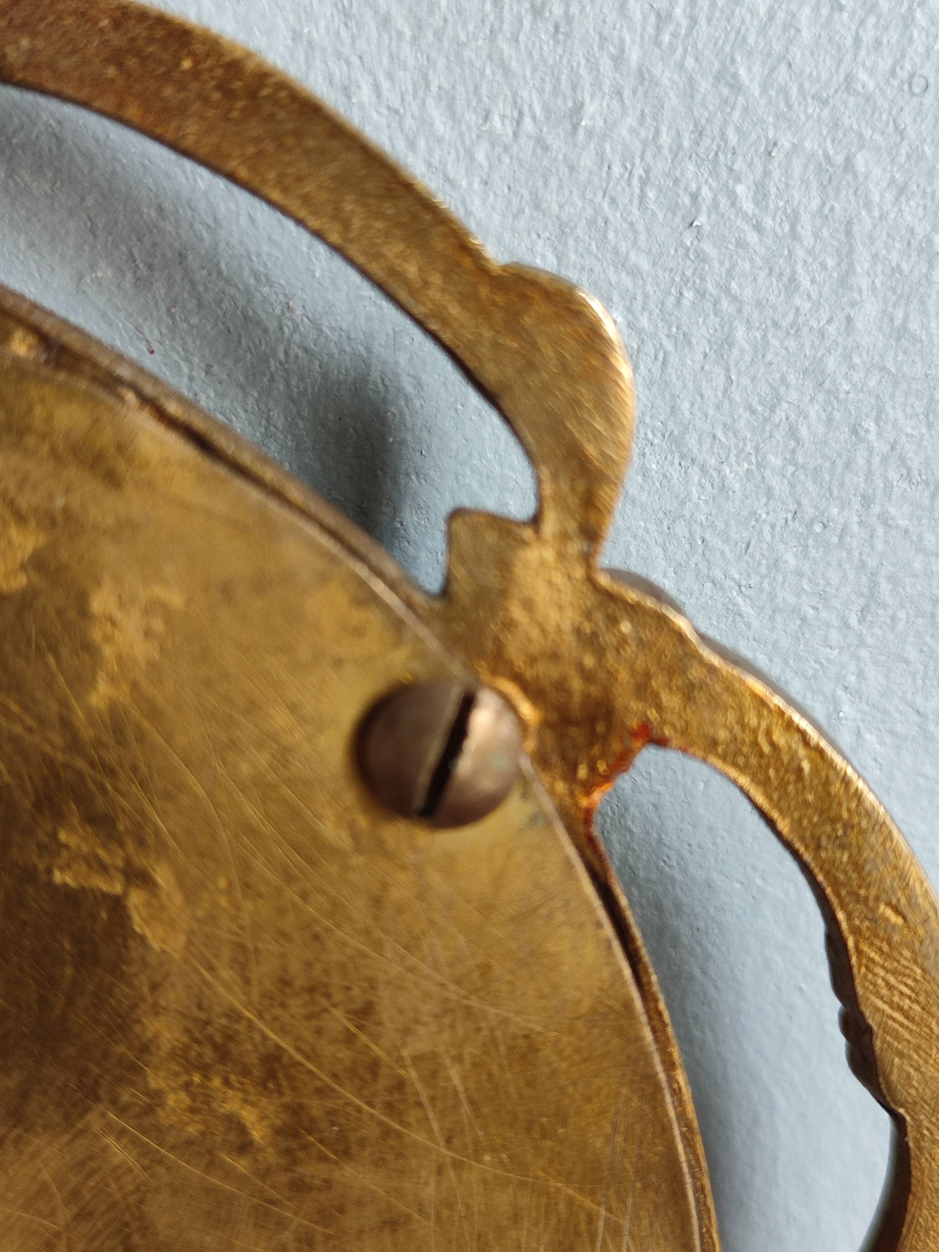 Antique hand-facing mirror in bronze and beveled glass