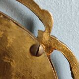 Antique hand-facing mirror in bronze and beveled glass