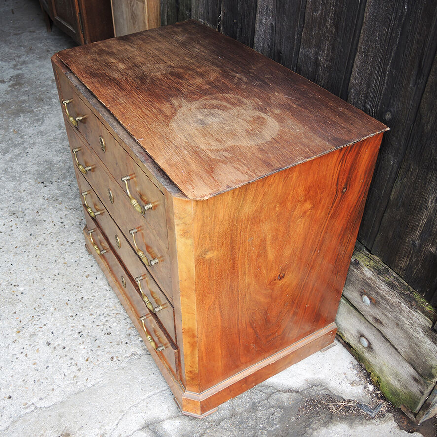 Old wooden chest of drawers with 4 drawers on wheels