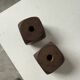 Pair of 1960s teak and brass "dice" candlesticks