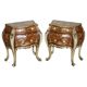 Pair of curved walnut commodes with marquetry and marble tops.
